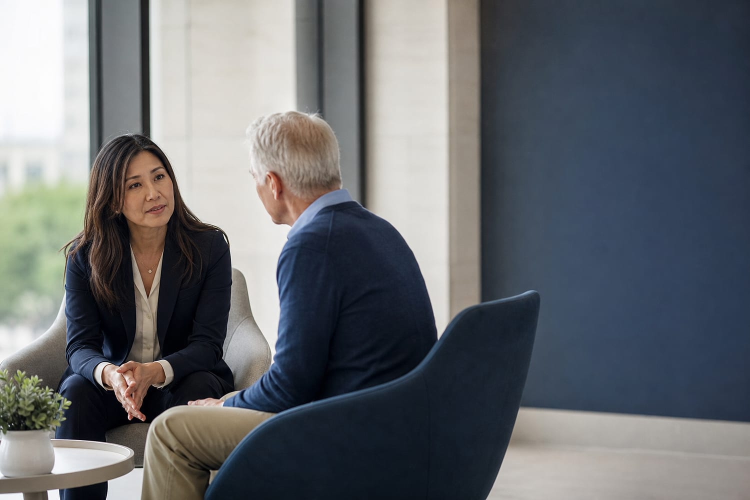 Patient financial counselor having a calm conversation in a modern hospital setting