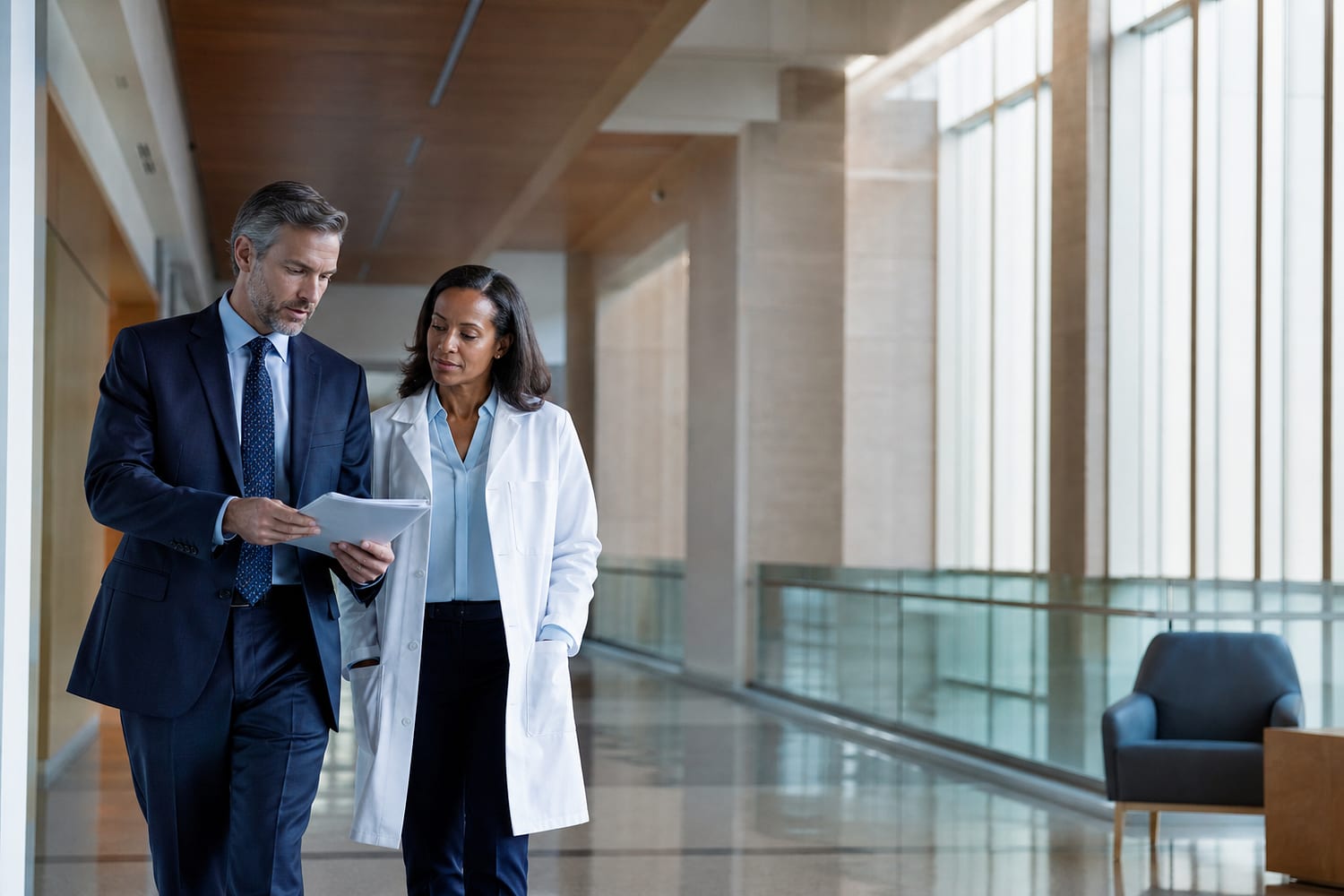 Hospital operations leader and clinical leader reviewing a plan